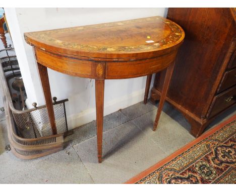 A late Georgian mahogany rosewood banded and rose decorated semicircular fold-over top card table, on square taper supports (