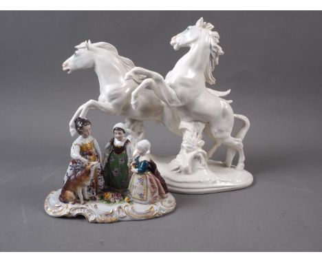 A Karl Ens porcelain model of two galloping horses, 10" high, and a porcelain figure group of the children of Charles 1st aft