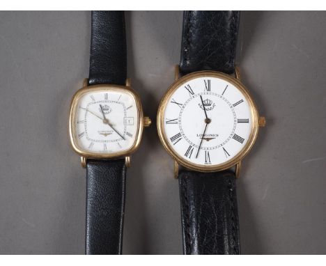 A gentleman's Longines quartz wristwatch with white enamel dial and Roman numerals, and a similar lady's wristwatch 