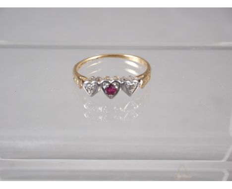 An 18ct gold, platinum, diamond and ruby sweetheart ring, size M, 2.1g 