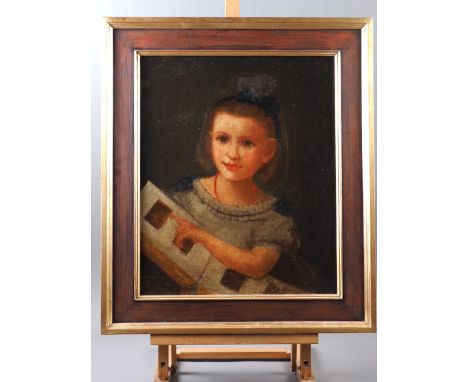 English School: oil on canvas, portrait of a young girl with carte de visite, 17 1/2" x 14 1/4", in wooden effect and gilt fr
