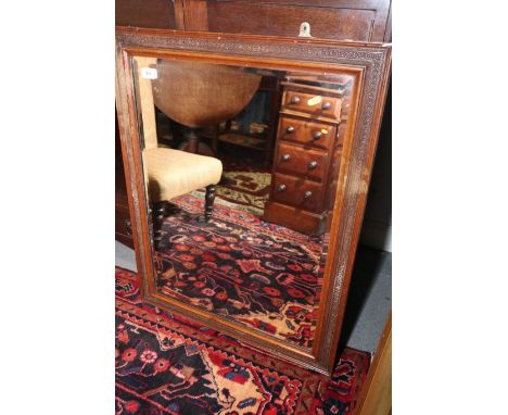 A late Victorian polished as mahogany rectangular bevelled plate wall mirror, plate 21" x 27",&nbsp;and a dome top travel tru
