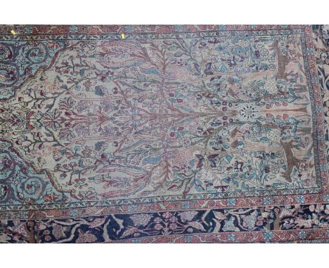 A Kirkman picture rug with trees, birds and figures, on a light ground, 86" x 54" approx (worn) 