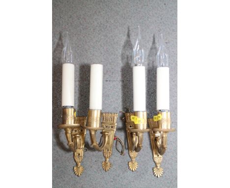 A set of four gilt brass single light wall brackets with quiver back plates and faux candles, 14" high (ex Fawley Court) 
