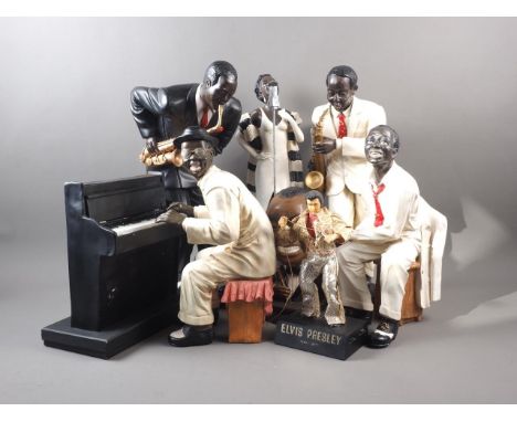 A composition African American jazz band, 18 1/2" high, a model of Louis Armstrong and an Elvis Presley radio 