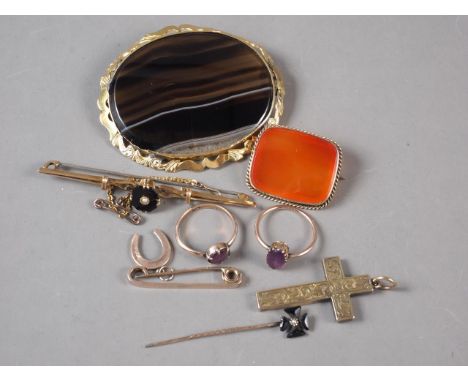 Two 9ct gold and amethyst rings, a yellow metal crucifix pendant, two 9ct gold bar brooches, two yellow metal framed hardston