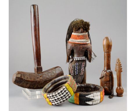 Two Nigerian bracelets beadwork, leather and cloth, 10cm and 11cm diameter, two Mossi whistles, one with a chain, a doll with