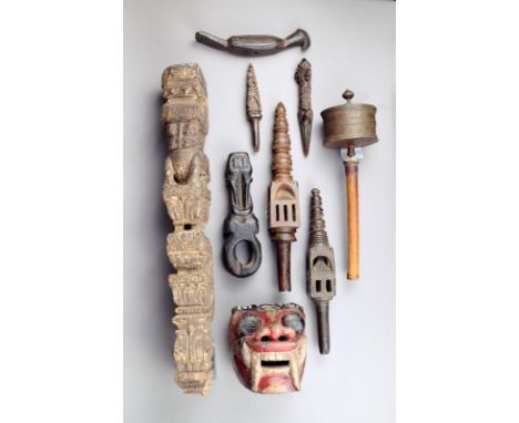 A Nepal ghurra wood with a thick black patina, 21cm high, a Nepal wood phurbu, three sceptres of architectural form, one on a