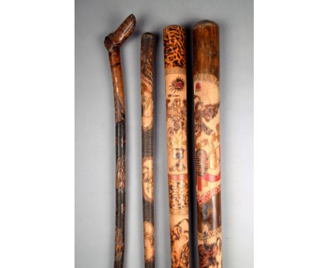 A Mexican walking cane wood, carved a dog's head handle, the national coat of arms, and bullfighting scenes, 92cm long, a sma