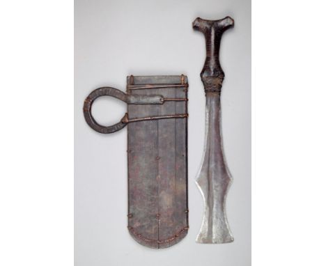 A Cameroon knife and scabbard with a shaped blade and leather covered bifurcated handle, the wood scabbard with a loop handle