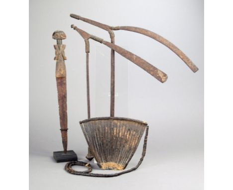 A Kirdi cache-sex Cameroon iron, fibre and coconut disks, 17cm wide, two North Nigerian ritual adzes, with copper wire and wi