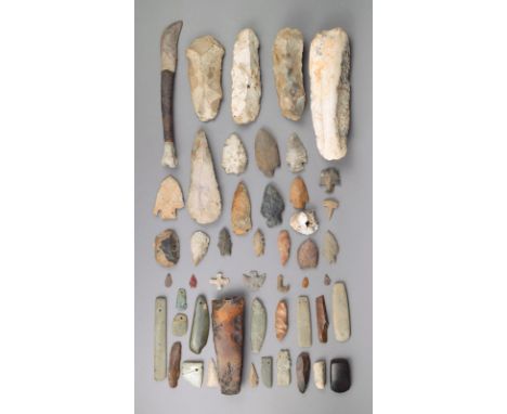 A collection of stone axe and arrowheads America and Europe Neolithic and later, one flint inscribed Thunder Barrow, Southwic