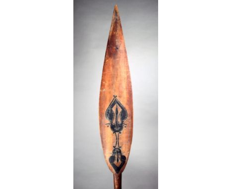 A Buka Island paddle Solomon Islands, Melanesia wood and pigment, the leaf shape blade carved two ancestor figures and the re