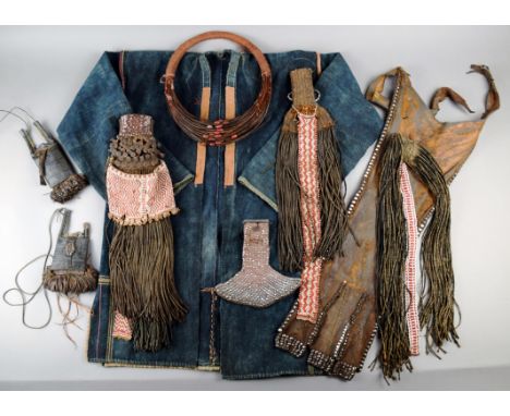 Three Kirdi aprons Cameroon beadwork, fibre, beads and buttons, 46cm the longest, a Samburu / Turkana hide apron with metal b
