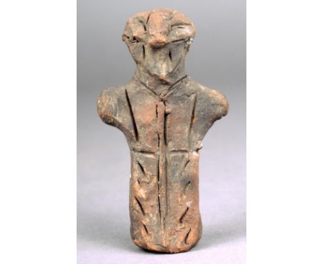 A Neolithic Vinca figure 5000 - 4000 BC ceramic with incised linear decoration, 9.5cm high. Provenance German collector, acqu