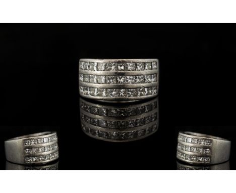 Platinum And Diamond Set Superb And Attractive Contemporary Ring Comprising three rows of ten channel set princess cut diamon