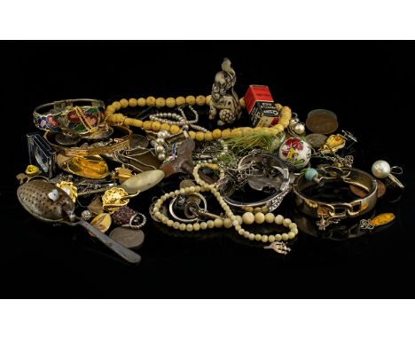 A Mixed Collection Of Costume Jewellery And Oddments To include carved bone bead necklace, gold tone enamel 1980's bangle, va
