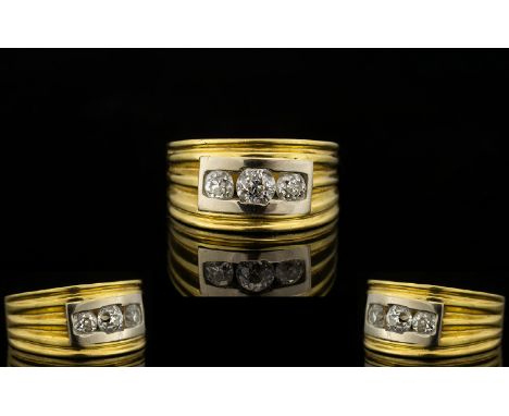 18ct Yellow Gold Contemporary Designed Three Stone Diamond Ring Of solid construct and pleasing, modern design. Estimated dia