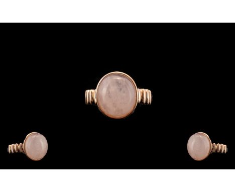 Morganite Solitaire Ring, an 10ct oval cut cabochon of natural morganite, an unusually large size for this gemstone, bezel se