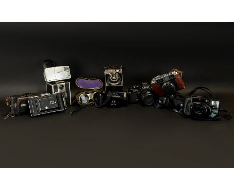 CAMERAS AND BINOCULARS. To include Jockey club Paris, Prinz, YASHICA, RICOH,  BELL &amp; HOWELL MODEL 65, MINOLTA, PENTAX ZOO