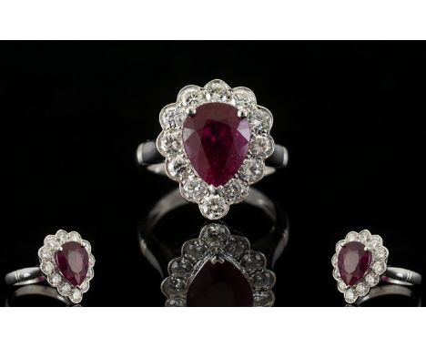 18ct White Gold Superb Pear Shaped Ruby And Diamond Cluster Ring Of stunning quality, the central pear shaped ruby of excelle