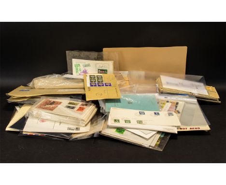 Large Carrier Bag Full of First Day Covers and Commemorative Covers, with loose stamps. Many are mint and in blocks. Strong L