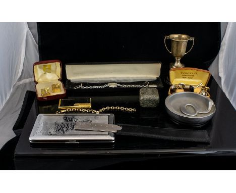 A Mixed Collection Of Oddments To include fashion watch, aluminium ashtray, cigarette case with etched decoration, slimline c