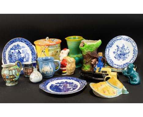 A Mixed Collection Of Ceramics And Collectibles To include vintage Butlins biscuit tin, glazed ceramic Santa money box, blue 