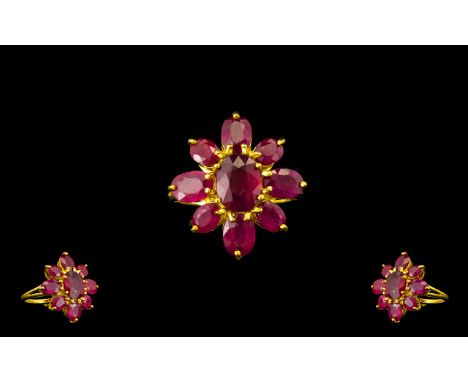 Ruby Flower Shape Ring, the centre oval cut ruby, of 3.75cts, surrounded by a further eight oval cut rubies, totalling 7cts, 