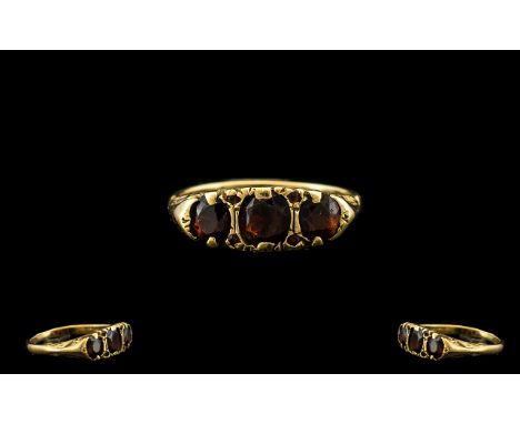 9ct Gold Three Stone Garnet Set Dress Ring Of pleasing form, fully hallmarked for 9ct gold, ring size P, good condition in al