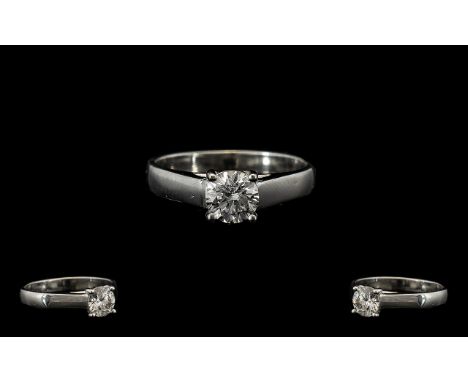 A Single Stone White Gold Diamond Ring Set with a round modern brilliant cut diamond, VS white commercial stone, estimated di