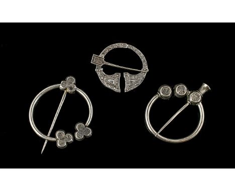 A Collection Of Antique Scottish Cloak Pins Three items in total, each of traditional pin buckle form, to include silver Celt