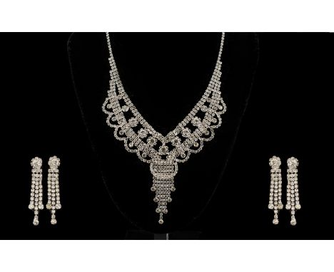 Crystal Scalloped and Fringed Pendant Necklace and Triple Drop Earrings Set, a V shaped bib necklace in clear crystal with tw