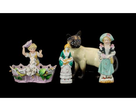 A Small Mixed Lot Of Ceramic Figures To include Beswick Siamese cat - marked to underside, two German figures and a n unmarke