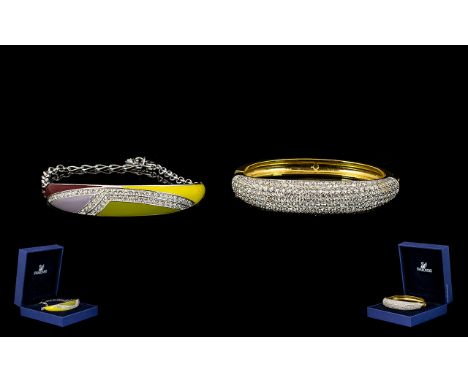 Swarovski Crystal Boxed Cuff Bracelets Two in total each in box with care card, comprising contemporary enamel and crystal se