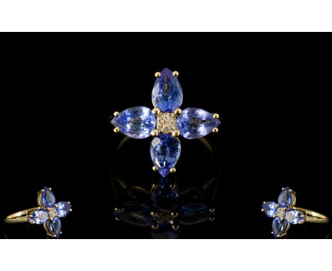 9ct Gold Tanzanite And Diamond Ring Central diamonds surrounded by four pear cut tanzanites. Fully hallmarked, modern ring, s