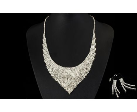 White Austrian Crystal Necklace and Earrings, a bib necklace with articulated sides and a V shaped panel to the centre, chain