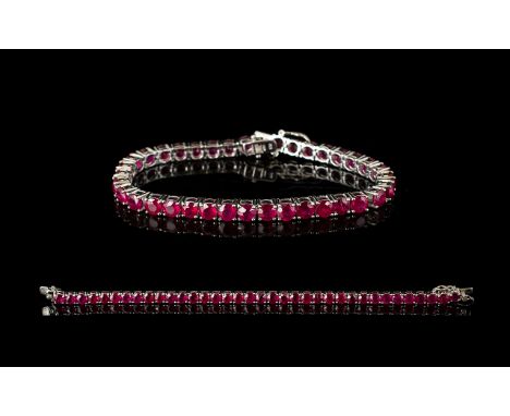 Ruby Tennis Bracelet, 50 round cut rubies of rich, glowing red, each measuring .5ct, an overall total of 25cts, closely set i