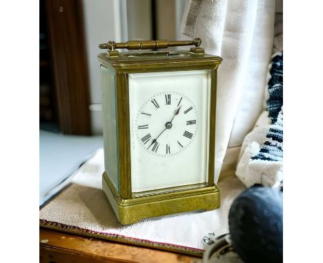 FRENCH BRASS REPEATER CARRIAGE CLOCK, white enamel face with Roman numerals, stamped 'R & Co Made In Paris', swing handleProv