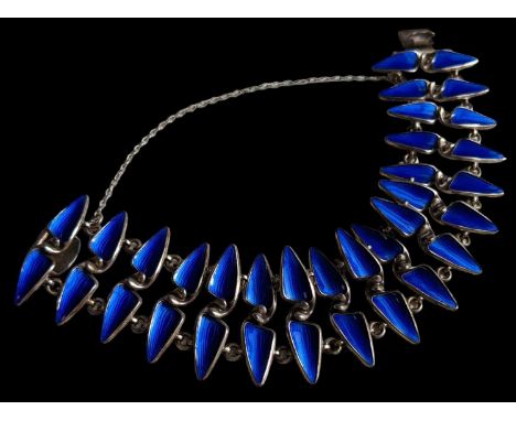 NORWEGIAN STERLING SILVER & ENAMEL BRACELET, the bracelet designed as two rows of teeth in deep blue enamel, designed by Eina