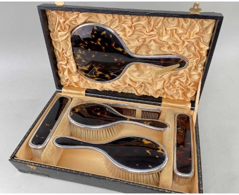 GEORGE V CASED SILVER & TORTOISESHELL DRESSING TABLE SET, W. G. Sothers Ltd., Birmingham 1921/24, comprising mirror, comb, tw