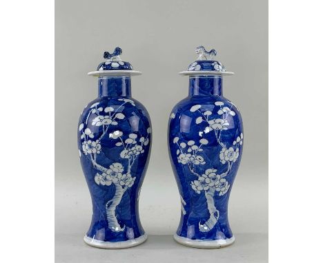 PAIR CHINESE BLUE & WHITE PORCELAIN VASES & COVERS, late Qing dynasty or later, baluster form painted with flowering prunus t