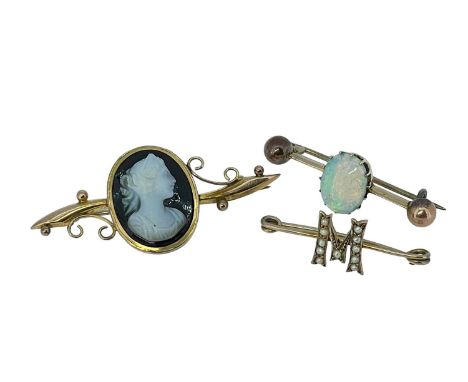 THREE BAR BROOCHES comprising 9ct gold carved cameo onyx brooch, yellow metal opal bar brooch and a yellow metal 'M' seed pea