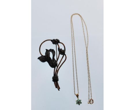 A vintage mid 20th century silver brooch in the form of three flowers set with marcasites with shaped gold plated stems. Meas