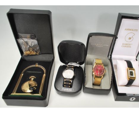 A collection of gents boxed unused dress wristwatches to include a Ammolite inlaid Korite dress watch, a Heritage Time full h