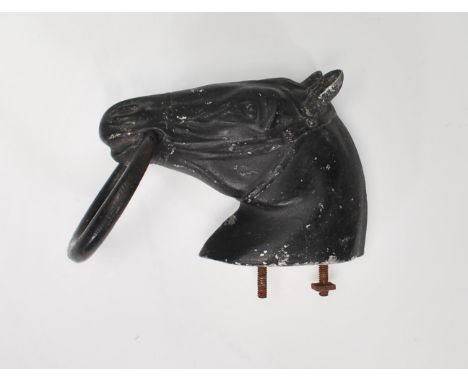 A vintage 20th Century cast ebonised horse head door knocker having stamped lettering to verso for W.Martin Lotz. Measures 14