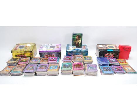 A good large collection of 800+ Konami Yu - Gi - Oh ! cards across four official tins. Multiple first editions to include Ebo