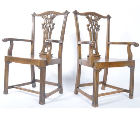 A late 19th century pair of Chippendale North Country solid oak carver dining chairs / armchairs. Raised on squared legs unit