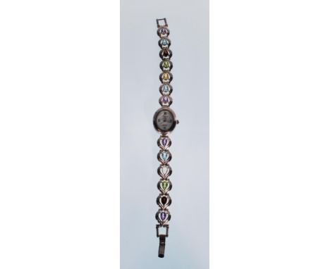 A ladies silver Precious Time dress watch having a bracelet strap set with 12 multicoloured tear drop cut stones, with an ova