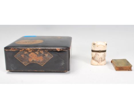 An early 20th Century Japanese lacquer papier mache lidded trinket box together with a Chinese&nbsp; bone lidded pot modelled